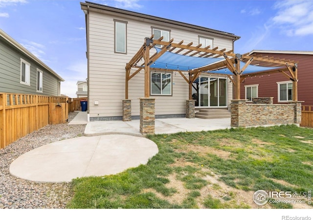 rear view of property with a pergola, a fenced backyard, entry steps, a patio area, and a yard