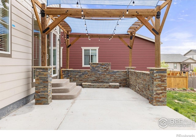 property entrance with a patio and fence