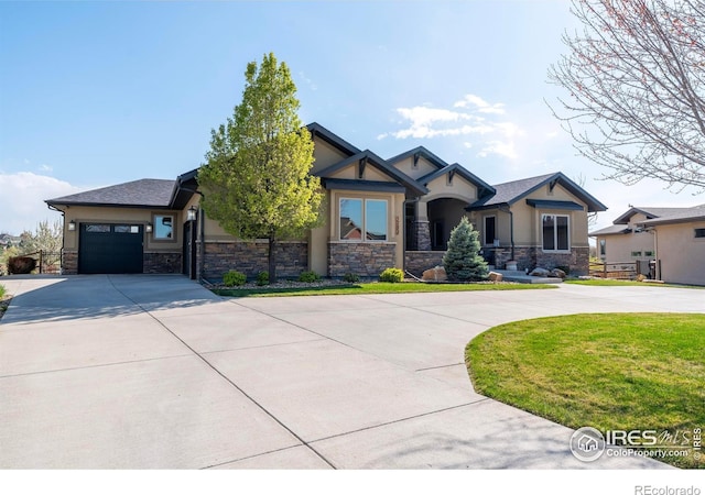 5751 Last Pointe Dr, Windsor, CO 80550 - craftsman-style house featuring curved driveway, stone siding, stucco siding, and a garage