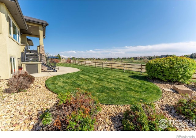 5751 Last Pointe Dr, Windsor, CO 80550 - view of yard with stairway and a patio area