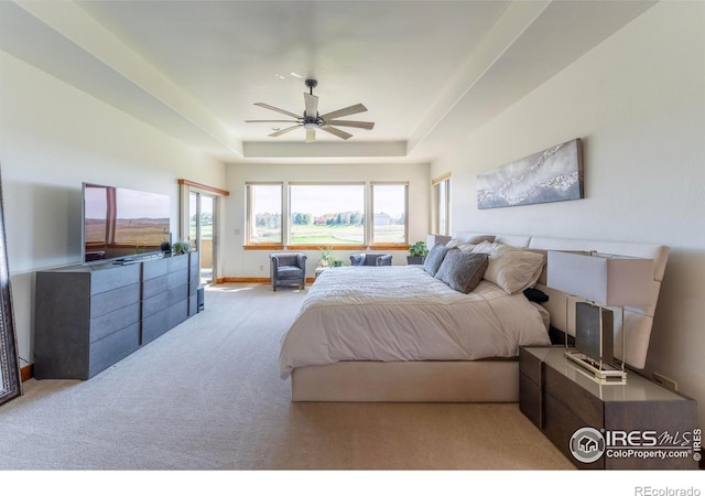 5751 Last Pointe Dr, Windsor, CO 80550 - bedroom featuring a tray ceiling, carpet floors, a ceiling fan, and baseboards