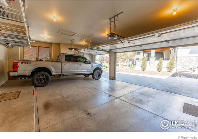 5751 Last Pointe Dr, Windsor, CO 80550 - garage featuring a garage door opener