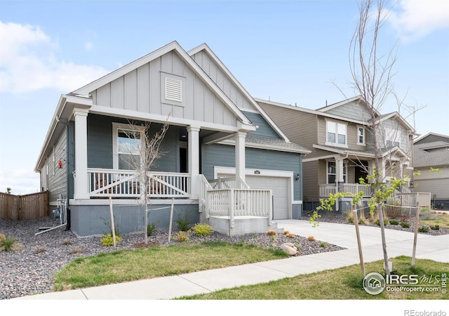 840 Clover Loop, Lafayette, CO 80026 - craftsman-style house featuring a porch, board and batten siding, a garage, fence, and concrete driveway