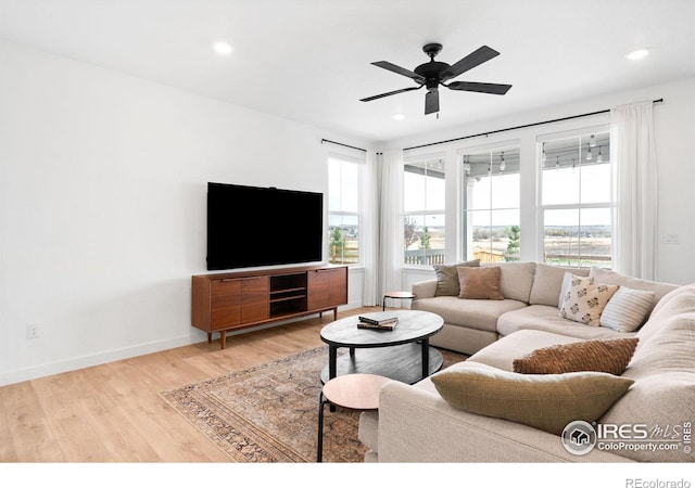 840 Clover Loop, Lafayette, CO 80026 - living room featuring light wood-style floors, baseboards, a ceiling fan, and recessed lighting