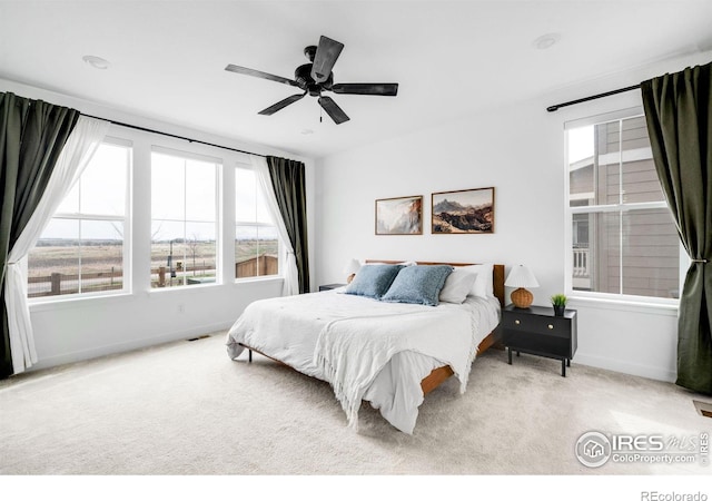 840 Clover Loop, Lafayette, CO 80026 - carpeted bedroom featuring a ceiling fan, baseboards, and visible vents