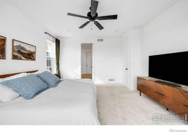 840 Clover Loop, Lafayette, CO 80026 - bedroom with baseboards, a ceiling fan, light colored carpet, and visible vents