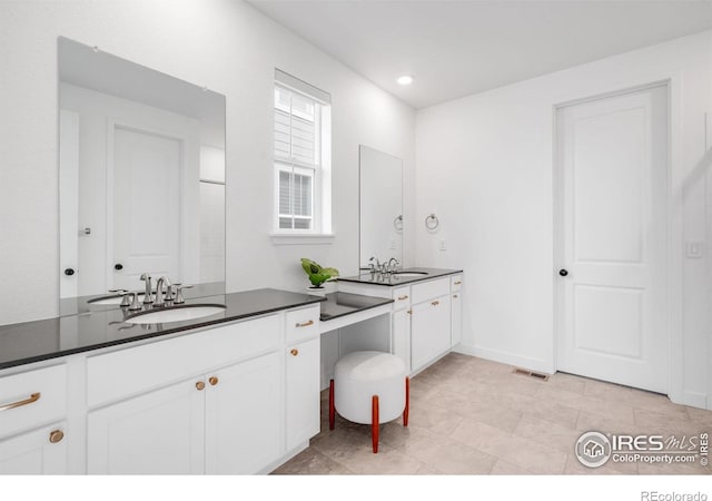 840 Clover Loop, Lafayette, CO 80026 - full bathroom with vanity, recessed lighting, and visible vents