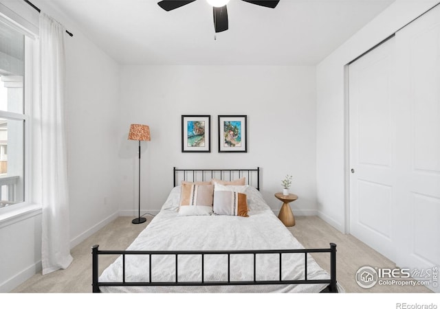 840 Clover Loop, Lafayette, CO 80026 - bedroom with baseboards, light carpet, and a ceiling fan