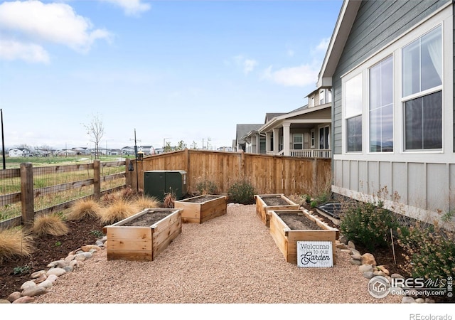 840 Clover Loop, Lafayette, CO 80026 - exterior space with fence and a vegetable garden