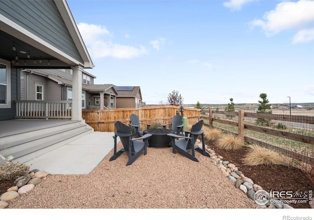 840 Clover Loop, Lafayette, CO 80026 - view of patio / terrace with fence and an outdoor fire pit