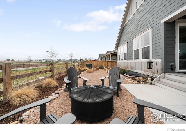 840 Clover Loop, Lafayette, CO 80026 - view of patio / terrace with a fire pit and fence