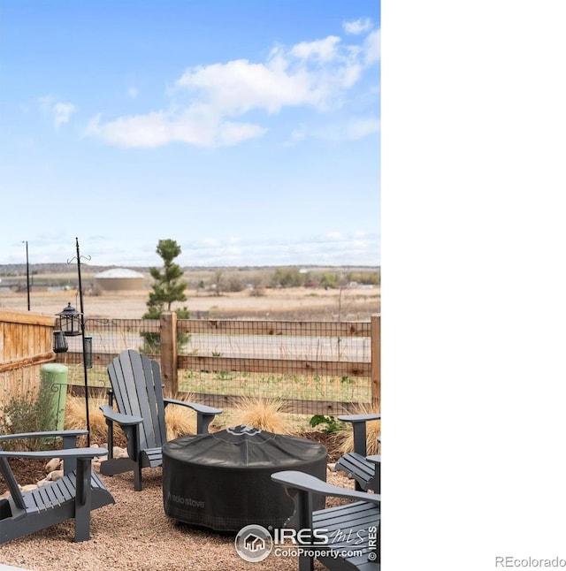 840 Clover Loop, Lafayette, CO 80026 - view of yard with an outdoor fire pit and fence