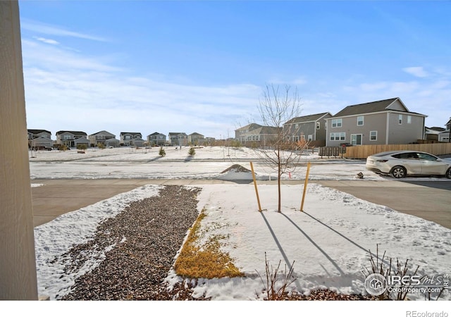 196 Bird Way, Lochbuie, CO 80603 - snowy yard with a residential view and fence