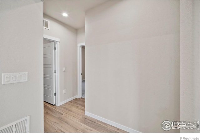196 Bird Way, Lochbuie, CO 80603 - corridor with wood finished floors, baseboards, and recessed lighting