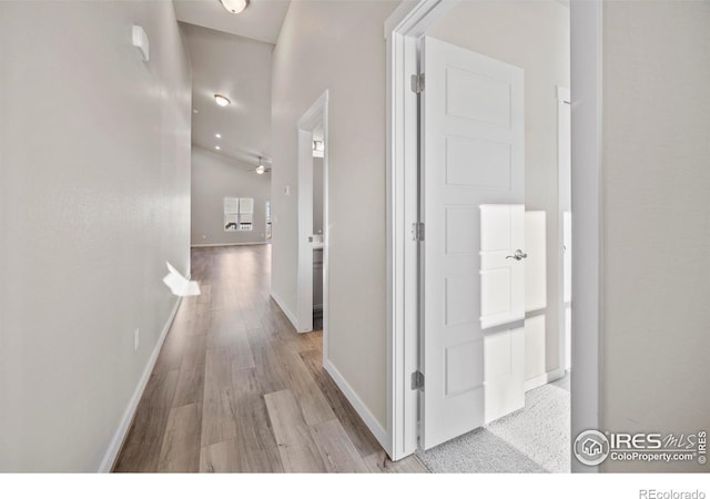 196 Bird Way, Lochbuie, CO 80603 - corridor featuring wood finished floors and baseboards