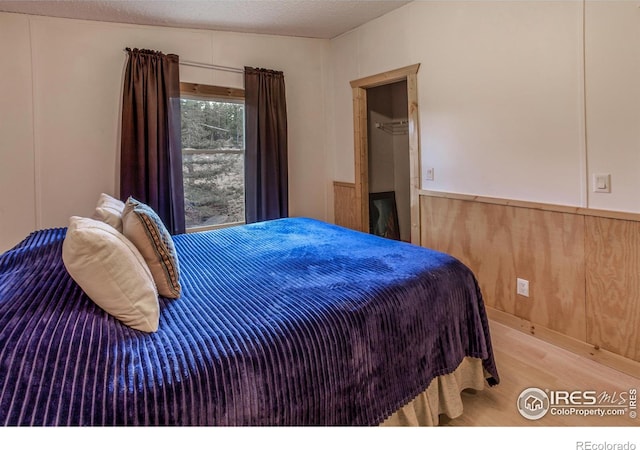 bedroom with wood finished floors