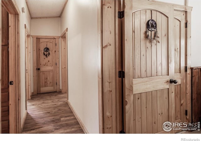 hall with wood finished floors