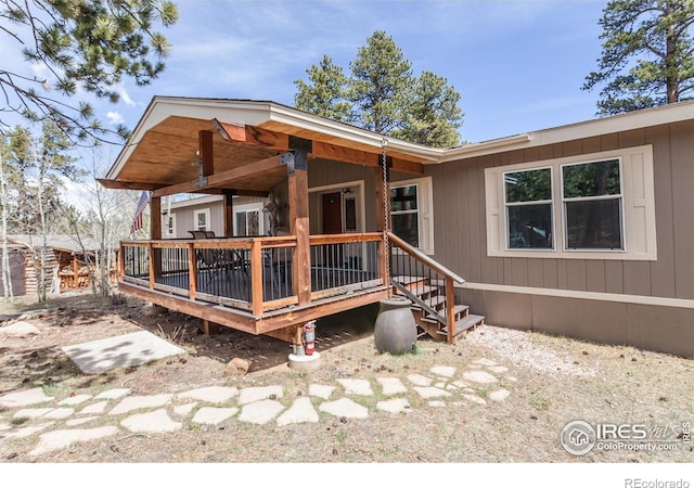 rear view of property with a deck
