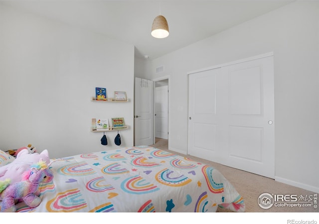 1312 Loraine Cir S, Lafayette, CO 80026 - carpeted bedroom with a closet, baseboards, and visible vents
