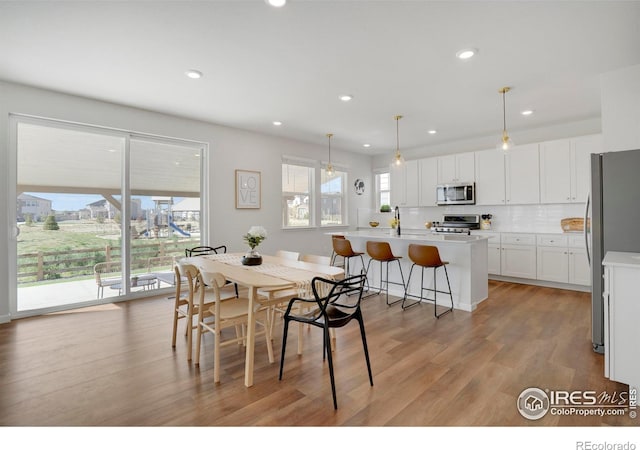 1312 Loraine Cir S, Lafayette, CO 80026 - dining space with light wood-type flooring and recessed lighting