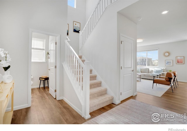 1312 Loraine Cir S, Lafayette, CO 80026 - stairs with baseboards and wood finished floors