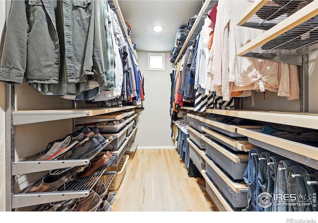 spacious closet with wood finished floors