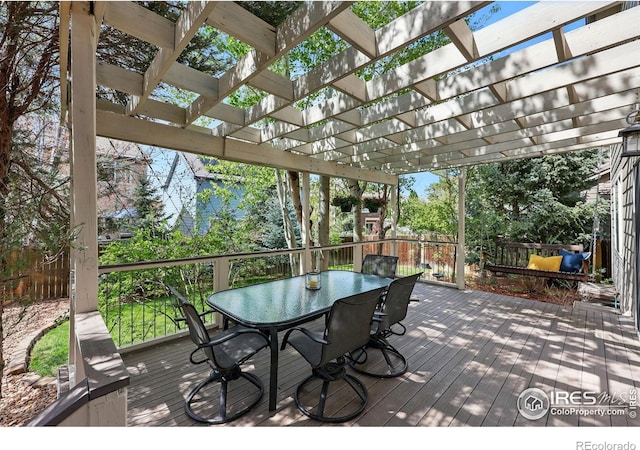wooden terrace featuring fence, a pergola, and outdoor dining area