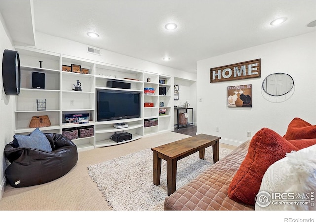 carpeted living room featuring visible vents, recessed lighting, and baseboards