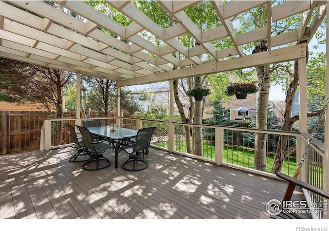 wooden terrace with fence, a pergola, and outdoor dining area