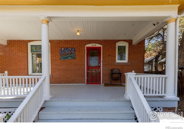 838 University Ave, Boulder, CO 80302 - property entrance featuring covered porch and brick siding