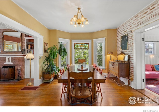 838 University Ave, Boulder, CO 80302 - dining space featuring wood-type flooring, baseboards, and a notable chandelier