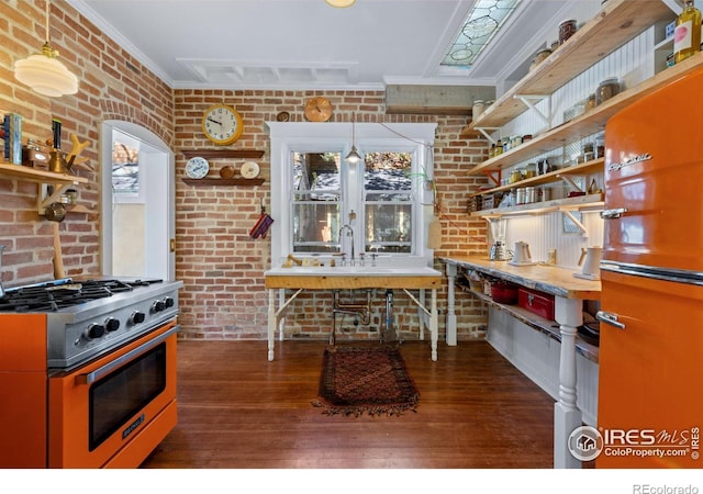 838 University Ave, Boulder, CO 80302 - kitchen with wood-type flooring, open shelves, ornamental molding, brick wall, and stainless steel gas range oven