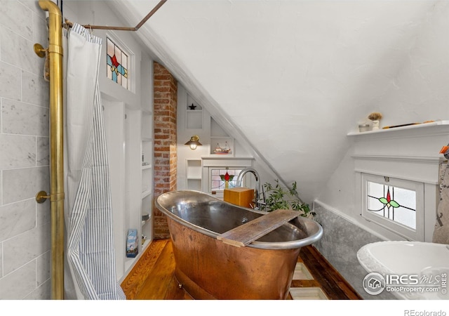 838 University Ave, Boulder, CO 80302 - full bathroom with a freestanding bath and lofted ceiling