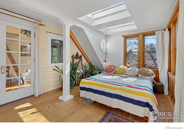 838 University Ave, Boulder, CO 80302 - bedroom featuring a skylight and wood finished floors