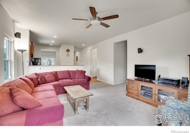living room with light colored carpet, recessed lighting, ceiling fan, and a wealth of natural light