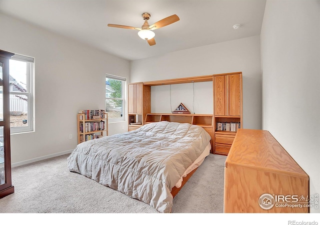 bedroom with baseboards, carpet, and ceiling fan