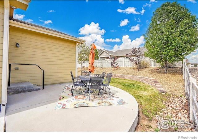 view of patio / terrace featuring a fenced backyard and outdoor dining space