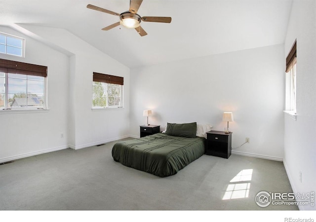bedroom with visible vents, baseboards, ceiling fan, carpet flooring, and vaulted ceiling