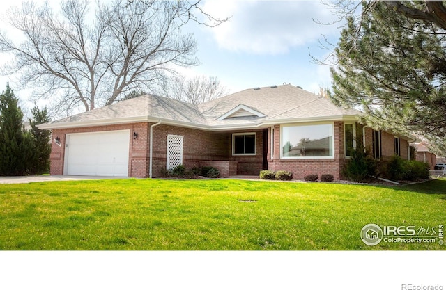 1609 Sherman Way, Longmont, CO 80501 - ranch-style house featuring an attached garage, a front yard, driveway, and brick siding