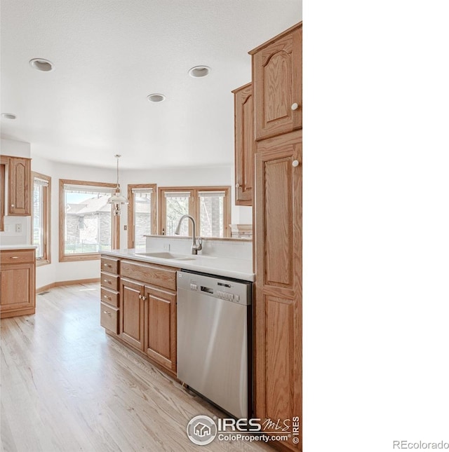 1609 Sherman Way, Longmont, CO 80501 - kitchen with a sink, light wood-style floors, light countertops, dishwasher, and recessed lighting