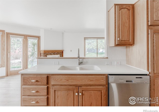 1609 Sherman Way, Longmont, CO 80501 - kitchen with a sink, light countertops, a wealth of natural light, and dishwasher