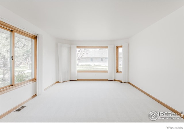 1609 Sherman Way, Longmont, CO 80501 - carpeted spare room featuring baseboards and visible vents