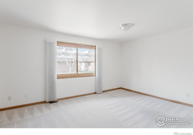 1609 Sherman Way, Longmont, CO 80501 - empty room featuring baseboards, light carpet, and visible vents