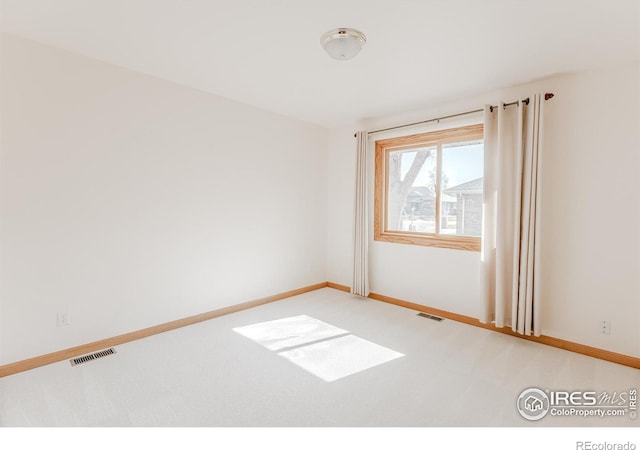 1609 Sherman Way, Longmont, CO 80501 - unfurnished room with baseboards, light carpet, and visible vents