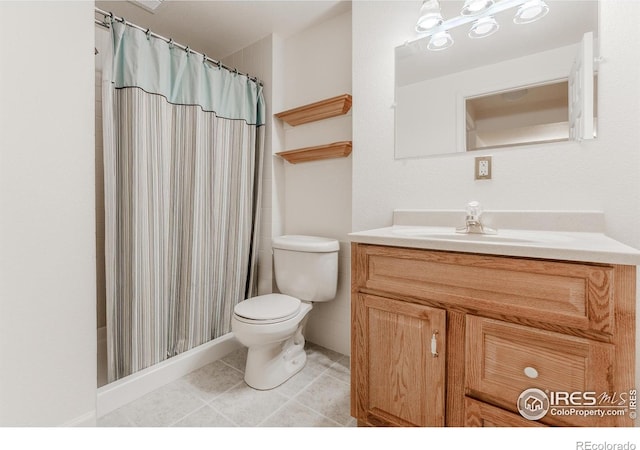 1609 Sherman Way, Longmont, CO 80501 - full bathroom with vanity, tile patterned floors, a shower with curtain, and toilet