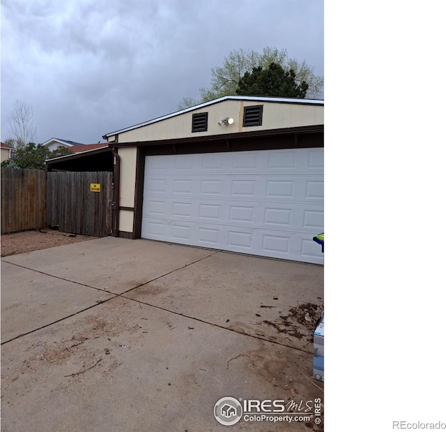 4202 Coronado St, Greeley, CO 80634 - garage featuring fence and driveway