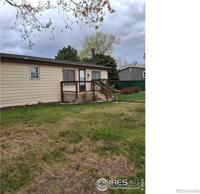 4202 Coronado St, Greeley, CO 80634 - back of property featuring a lawn