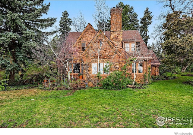 1025 5th St, Boulder, CO 80302 - view of front facade with a chimney, a front lawn, and stone siding