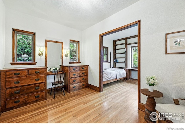 1025 5th St, Boulder, CO 80302 - bedroom with light wood-style floors, baseboards, and multiple windows