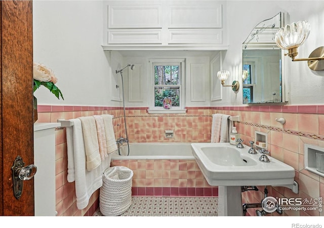 1025 5th St, Boulder, CO 80302 - full bath with tiled shower / bath combo, tile walls, tile patterned flooring, and a wainscoted wall